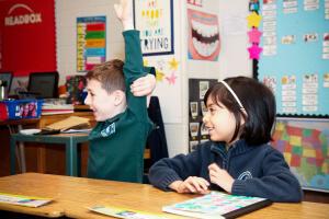 Lower School Student raising hand